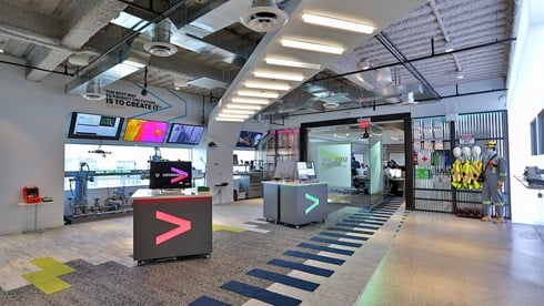 HTX Hub — Accenture Houston studio interior with branded kiosks